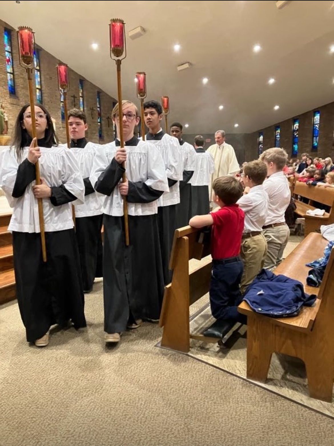 Students serving Mass